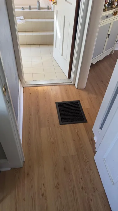 Warm wood-look flooring around dining furniture