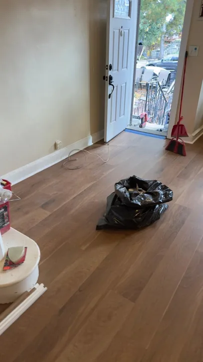 Wide warm-toned planks connecting residential rooms — work in progress