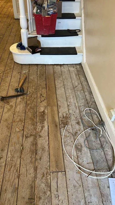 Floor preparation and installation details in a residential interior — work in progress
