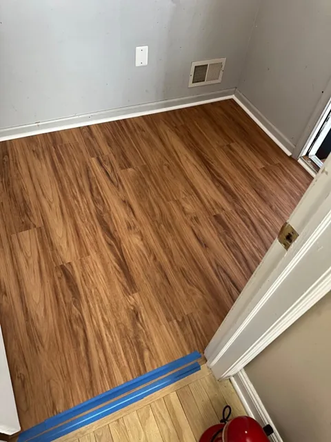 Amber-toned flooring in a residential utility room