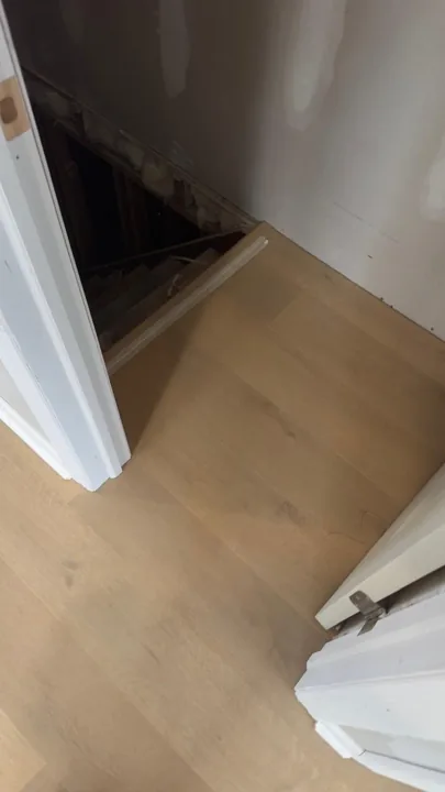 Pale wide-plank vinyl flooring during an interior renovation — work in progress