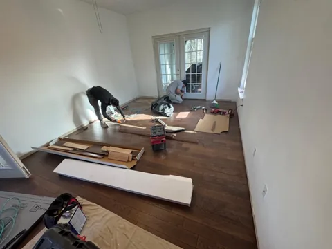 Brown hardwood flooring with pronounced natural grain — work in progress