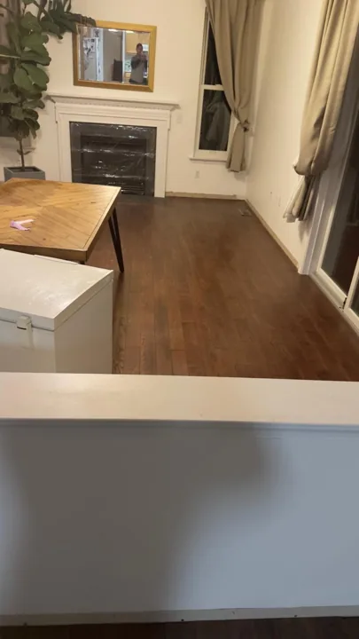 Brown hardwood flooring with pronounced natural grain — work in progress
